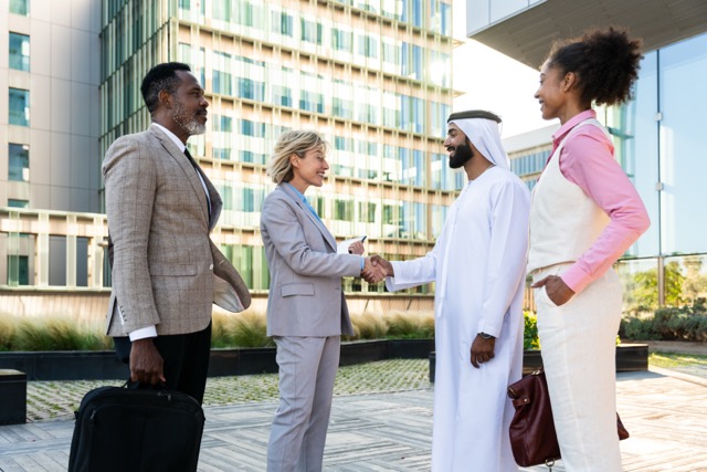 Group of multiethnic business people meeting an emirati businessman