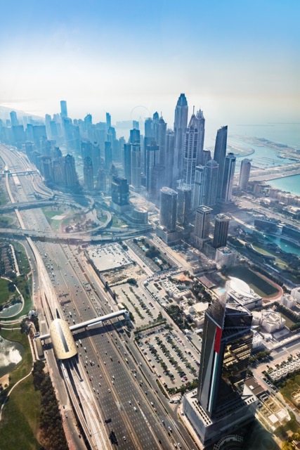 Dubai aerial view of marina skyscrapers at sunset.